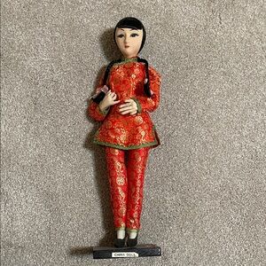 Red and Gold China Doll Figurine